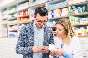 Man asking advice to the pharmacist woman