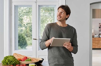Man with a tablet in a kitchen